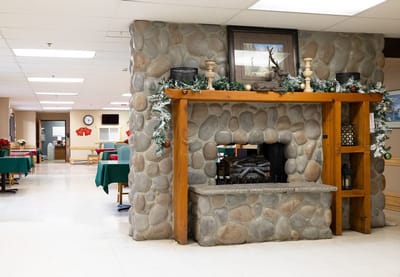 Cozy dining area with a stone fireplace