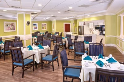 Dining area with neatly arranged tables and chairs