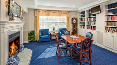 Common area with fireplace and seating for residents