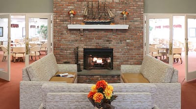 Cozy common area with a fireplace and seating