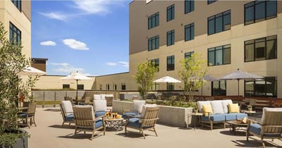 Outdoor seating area with lounge chairs and umbrellas