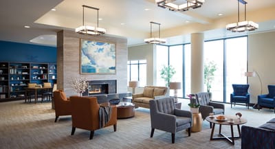 Comfortable lounge area with modern decor and large windows