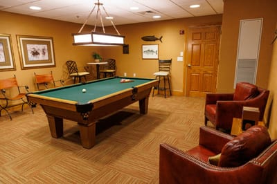 Interior common area with a pool table and seating