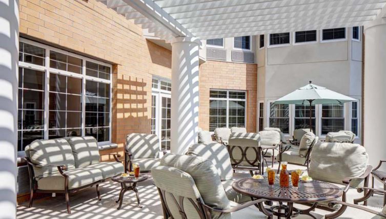 Outdoor patio area with seating and umbrellas