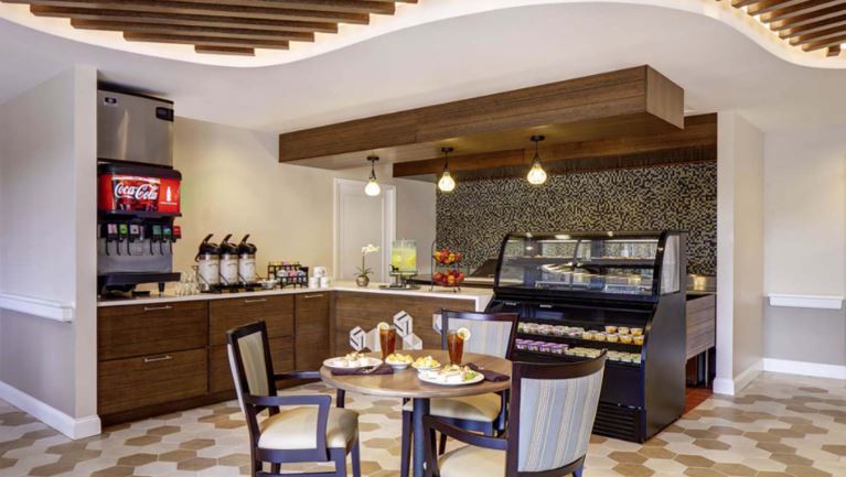 Dining area with a snack counter and dessert display