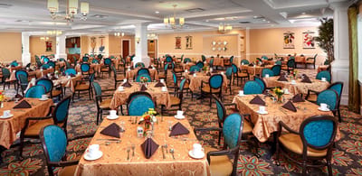 Elegant dining room setup with tables and decorations