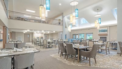 Dining area setup for residents with tables and chairs