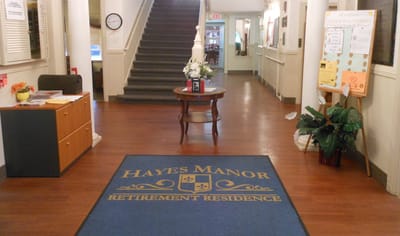 View of the entrance hall with the facility name mat