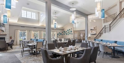 Bright dining area with tables set for a meal
