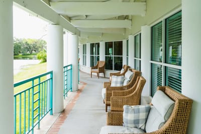 Outdoor seating area along a covered walkway