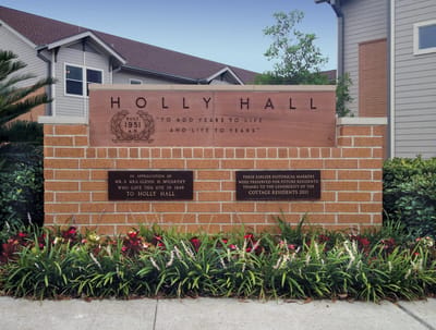 Signage at the entrance of Holly Hall facility