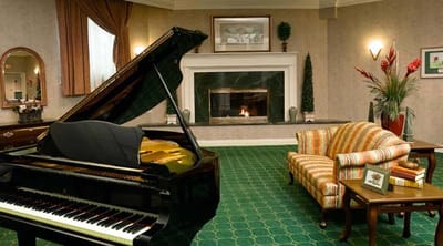 Interior lounge with piano and seating area