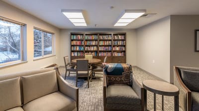 Interior common area with bookshelves and seating