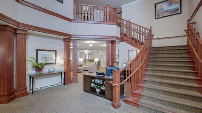 Interior view of a welcoming lobby with stairs
