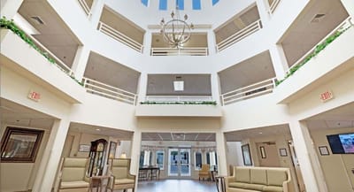 Bright common area with high ceilings and seating