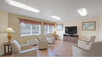 Bright common area with seating and television