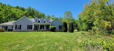 Exterior view of Harpeth Manor surrounded by greenery