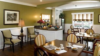 Bright dining area with tables and food layout