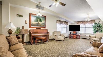 Cozy common area with seating and piano