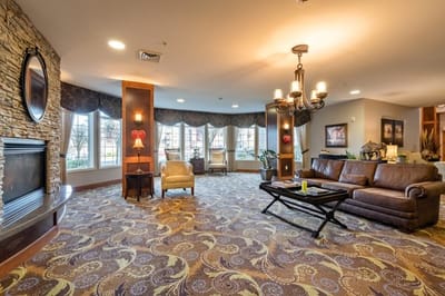 Cozy common area with comfortable seating and a fireplace