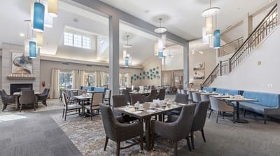 Spacious dining room with tables set for a meal