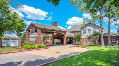 Exterior view of Lone Star Living entrance with garden