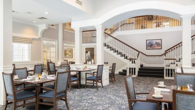 Bright dining room with tables set for meals