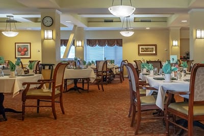 Interior view of a dining room with tables set