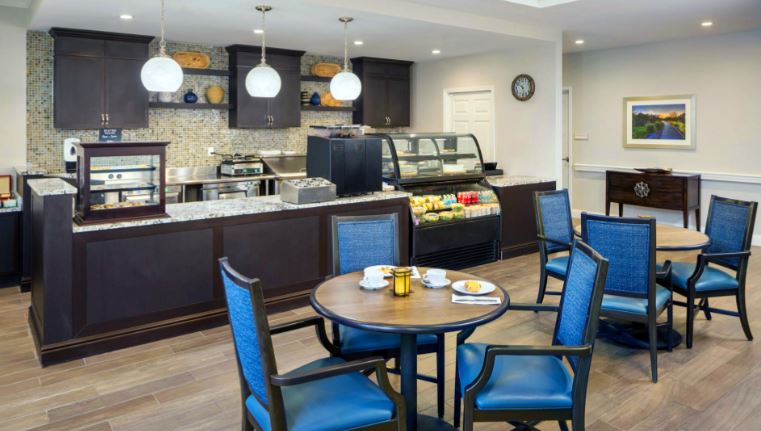Dining room with tables set for breakfast