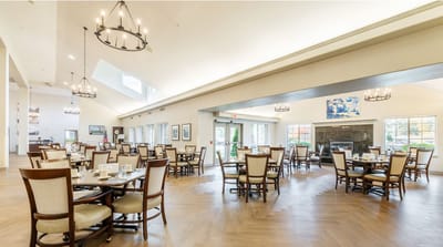 Bright dining room with tables set for a meal