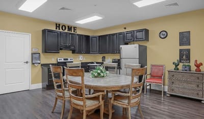 Brightly lit common area with dining table and decor