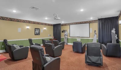 Interior view of a movie theater room with chairs
