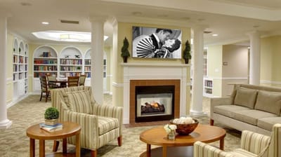 Cozy common area with seating and bookshelves
