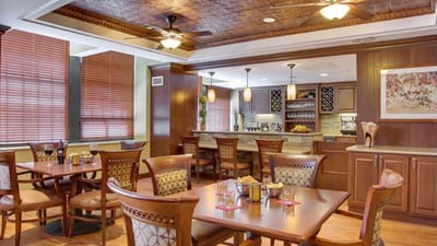 Bright dining room with wooden decor and tables