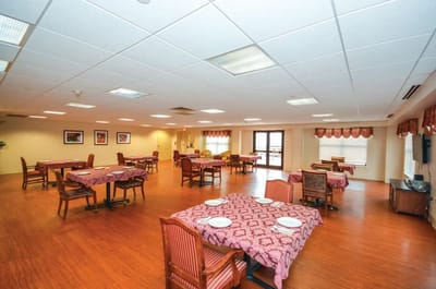 Dining room with tables set for residents