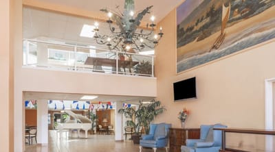 Common area with a chandelier and seating