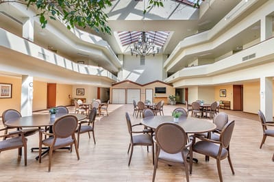 Bright common area with tables and chairs