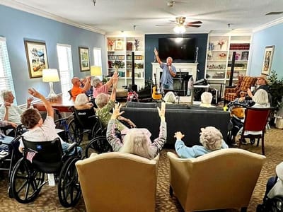 Residents participating in a lively music activity session