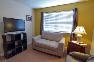 Cozy living room with a couch and lamp