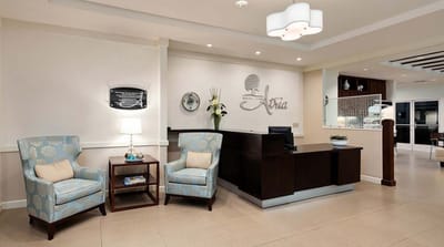 Reception area with chairs and front desk.