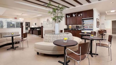 Bright common area with comfortable seating and decor