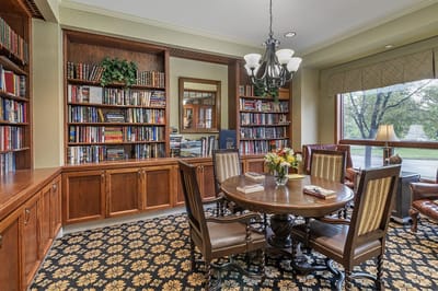 Comfortable library space with bookshelves and seating