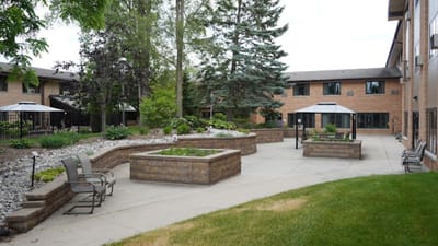 Garden area with seating and pathways at Pine Haven