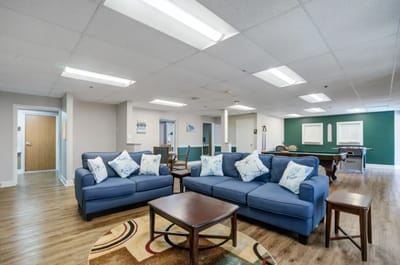 Bright common area with comfortable seating and decor