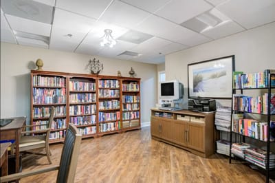 Cozy library area with bookshelves and seating