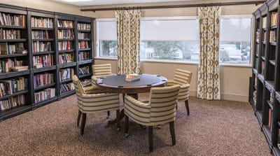 A cozy reading area with bookshelves and seating