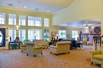 Bright common area with seating and large windows