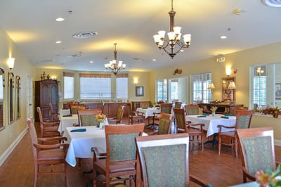 Interior view of a dining room with tables and chairs