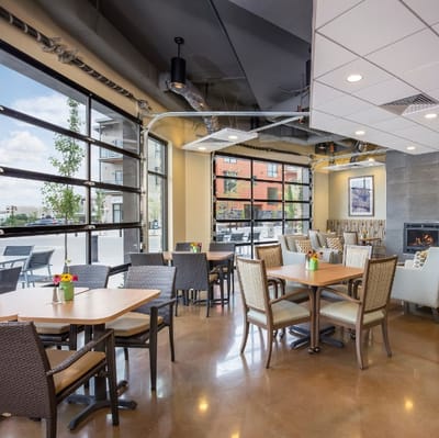 Bright dining area with tables and chairs