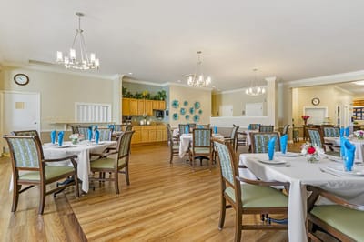 Bright dining room with tables set for a meal